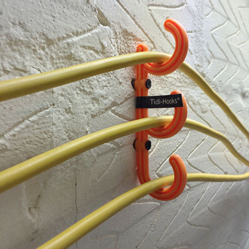 Tidi-Hooks-Cable-Hooks-In-Use-On-The-Wall